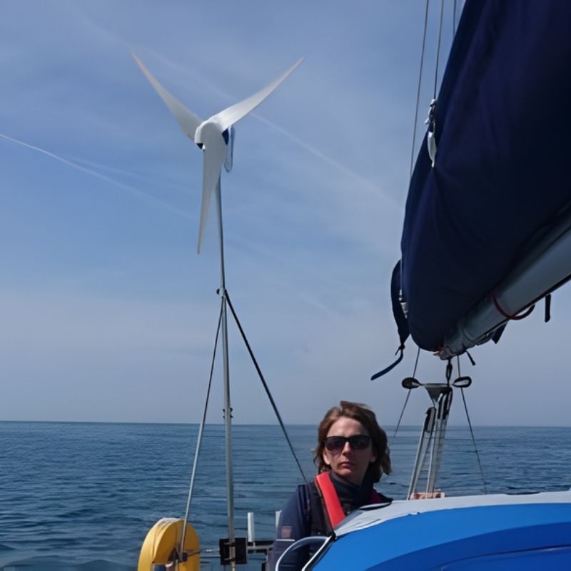 Marlec Rutland 1200x Marine Wind Turbine with MPPT Controller 12V - woman on the boat in open sea